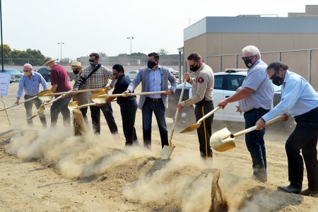 Local officials and guests break ground for the new Kings County Sheriff's Department headquarters.